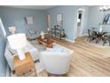 Bright living room features modern furniture, neutral tones, and wood flooring at 3723 N Olney St, Indianapolis, IN 46218