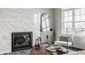 Elegant living room with a cozy fireplace, designer furnishings, and ample natural light creating a warm ambiance at 440 S Meridian Unit A-Bldg D St, Greenwood, IN 46142