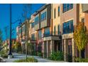Charming street view showcasing modern townhomes with manicured landscaping and inviting curb appeal at 440 S Meridian Unit A-Bldg D St, Greenwood, IN 46142