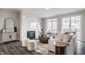 Bright living room with a fireplace, neutral tones, modern furnishings, and a large window for natural light at 444 S Meridian Unit B-Bldg D St, Greenwood, IN 46142