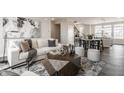 Comfortable living room with a plush couch, modern decor, and an open layout leading to the dining area at 444 S Meridian Unit B-Bldg D St, Greenwood, IN 46142