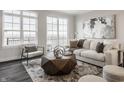 Cozy living room with a sofa, chair, balcony access, and a contemporary art piece at 444 S Meridian Unit B-Bldg D St, Greenwood, IN 46142