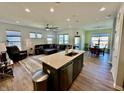 Open concept living and dining areas featuring hardwood floors and plenty of natural light at 50 Hovden Dr, Cicero, IN 46034