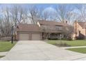Inviting two-story home with a spacious driveway and attached two-car garage at 504 Stony Creek Cir, Noblesville, IN 46060
