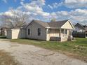 Well-kept one-story home with an attached garage, offering convenience and functionality at 609 S Grant St, Martinsville, IN 46151