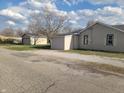 View of home with detached garage, great space to park vehicle or storage space at 609 S Grant St, Martinsville, IN 46151