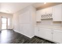 A living room with cabinets and modern flooring at 6117 Arctic Cir, Indianapolis, IN 46237