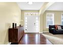 Inviting entryway with hardwood floors and view of the living room at 6126 Golden Eagle Dr, Zionsville, IN 46077