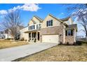 Well-maintained two-story home with attached two-car garage and driveway at 6126 Golden Eagle Dr, Zionsville, IN 46077