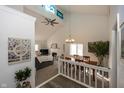 Open-concept living room boasts vaulted ceilings, fireplace, and seamless flow to the dining area for entertaining at 615 Conner Creek Dr, Fishers, IN 46038
