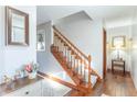 Bright foyer with hardwood floors, a staircase, and neutral wall paint at 6530 Grant Wood Ct, Indianapolis, IN 46256