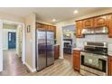 Well-lit kitchen featuring stainless steel appliances, cherry cabinets and granite countertops at 6878 Black Oak East Ct, Avon, IN 46123