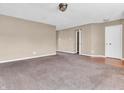 Cozy living room with neutral paint, carpeting, and ample natural light at 10830 Clear Spring Dr, Camby, IN 46113