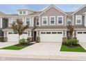 Attractive townhouse featuring a two-car garage and tidy front lawn at 1257 Newton St, Avon, IN 46123