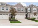 Beautiful townhouse with a spacious two-car garage and a well-kept front yard at 1257 Newton St, Avon, IN 46123