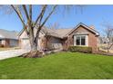 Beautifully landscaped front yard complements this charming home's exterior at 2056 Suda Dr, Carmel, IN 46280