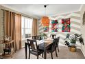 Inviting dining room featuring a stylish light fixture, modern art, and comfortable seating for six at 2504 Boylston Ct, Zionsville, IN 46077