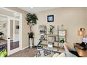 Cozy home office with decorative shelving, ample natural light, and comfortable workspace at 2504 Boylston Ct, Zionsville, IN 46077