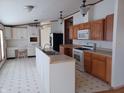 A kitchen area with white and wood cabinets, plenty of counter space, and modern appliances at 3336 Fall Valley Dr, Columbus, IN 47203