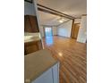 The spacious living room offers ample natural light and features stylish wood-look flooring at 3336 Fall Valley Dr, Columbus, IN 47203
