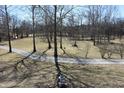 Beautiful landscaped grounds with mature trees and well-maintained pathways at 3546 Stierwalt Rd, Quincy, IN 47456