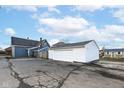 Detached two-car garage with white siding, visible from the property's backyard at 516 W Washington St, Lebanon, IN 46052