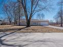 Traditional home with a neutral color palette, an attached garage, and a spacious yard at 5197 Oakridge Dr, Mooresville, IN 46158