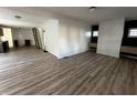 Open-concept layout showcases sleek floors seamlessly connecting the living area to the kitchen at 744 Wallace Ave, Indianapolis, IN 46201