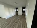 Bright living room featuring sleek floors and fresh paint at 744 Wallace Ave, Indianapolis, IN 46201