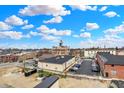 An aerial view captures the city skyline and the building under a bright, cloudy sky at 76 E Wayne St # B, Franklin, IN 46131