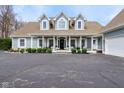 Charming light-blue home with a welcoming front porch and well-maintained landscaping at 8015 Sargent Rdg, Indianapolis, IN 46256