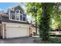A charming home featuring a two-car garage and stone detailing on the facade at 8061 Lower Bay Ln # 1, Indianapolis, IN 46236