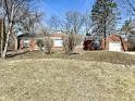 Charming single-story home with brick facade, attached garage, and well-maintained lawn at 1410 E 8Th St, Anderson, IN 46012