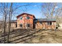 Backyard view of house with brick accents and multiple windows at 1431 W Edgewood Ave, Indianapolis, IN 46217