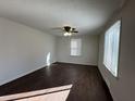 Bright bedroom with a ceiling fan, natural light from a window, and warm wood-look flooring at 1509 S Hawthorne Ln, Indianapolis, IN 46203