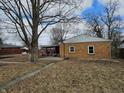 Property with a covered patio and expansive yard, ideal for outdoor entertainment and activities at 2113 Silver St, Anderson, IN 46012