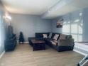Cozy living room with a comfortable sectional sofa and a large TV at 254 Halldale Dr, Whiteland, IN 46184