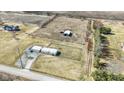 Expansive aerial view of property featuring residence, outbuildings, and open farmland at 2668 S 600 W, Lebanon, IN 46052