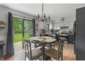 Eat-in kitchen with stainless steel appliances and sliding doors to the backyard at 520 N Pine St, Morgantown, IN 46160