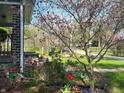 Close up view of exterior home details with beautiful landscaping and garden in full bloom at 5533 Wilson Way, Jamestown, IN 46147