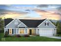 Charming single-story home showcasing blue siding, well-manicured lawn, and a convenient two-car garage at 651 Rylan Cir, Greenwood, IN 46142
