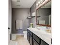 Bathroom with a double sink vanity, decorative mirror, and modern fixtures; great storage at 659 Melrose Ct, Greenfield, IN 46140