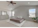 Bright primary bedroom featuring vaulted ceiling, neutral walls, plush carpeting, and ample natural light at 659 Melrose Ct, Greenfield, IN 46140