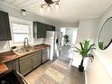 Spacious kitchen showcasing stainless steel appliances, wood countertops and a large window at 7047 Evanston Ave, Indianapolis, IN 46220