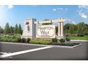 Hampton Walk community sign with lush landscaping and decorative lighting, marking the entrance to the neighborhood at 7280 Bailow Ln, McCordsville, IN 46055