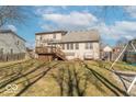 Backyard featuring a wooden deck with stairs and a swing set at 7331 Autumn Ct, Avon, IN 46123