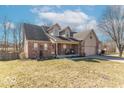 View of the home's exterior highlighting its architecture, garage, and surrounding yard at 7331 Autumn Ct, Avon, IN 46123