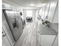 Modern kitchen features stainless steel appliances and granite countertops at 7807 Inverness Dr, Indianapolis, IN 46237