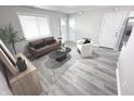 Cozy living room features modern decor and a window providing natural light at 7807 Inverness Dr, Indianapolis, IN 46237