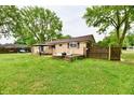 A sprawling backyard with a deck area providing an excellent space for outdoor entertaining at 812 Madison St, Frankton, IN 46044